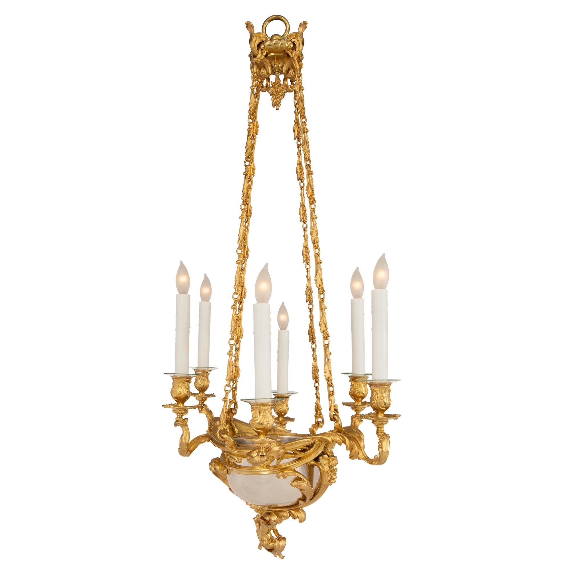 A French 19th century Louis XV st. silvered bronze and ormolu six light chandelier, attributed ...