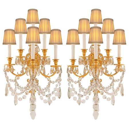 A pair of French 19th century Louis XVI st. ormolu and Baccarat crystal sconces