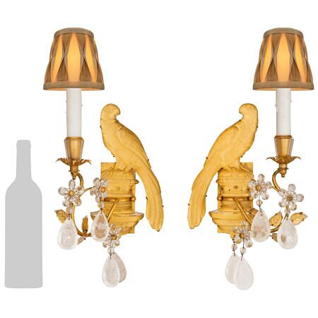 A true pair of French turn of the century Louis XVI st. Rock Crystal and Gilt Metal sconces, attributed to Maison Baguès